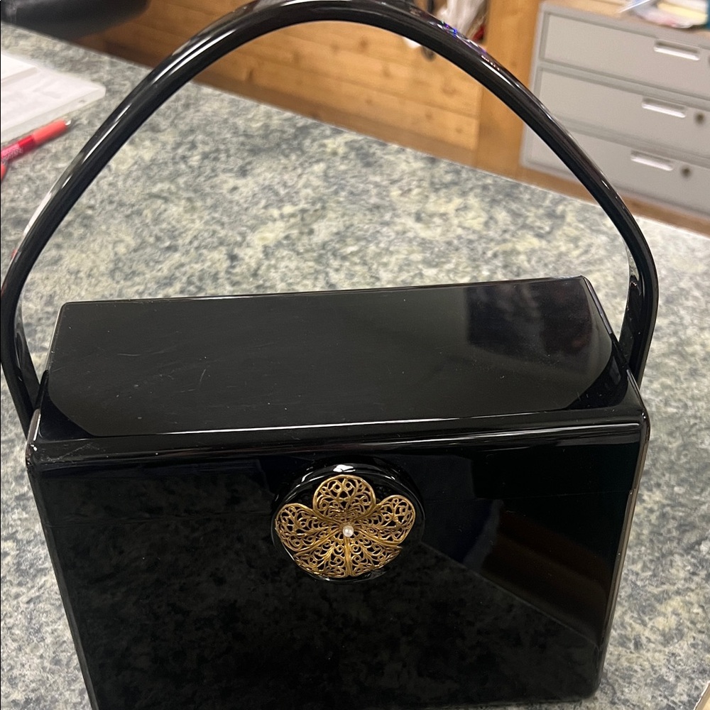 Elegant Black Handbag with Gold Accent